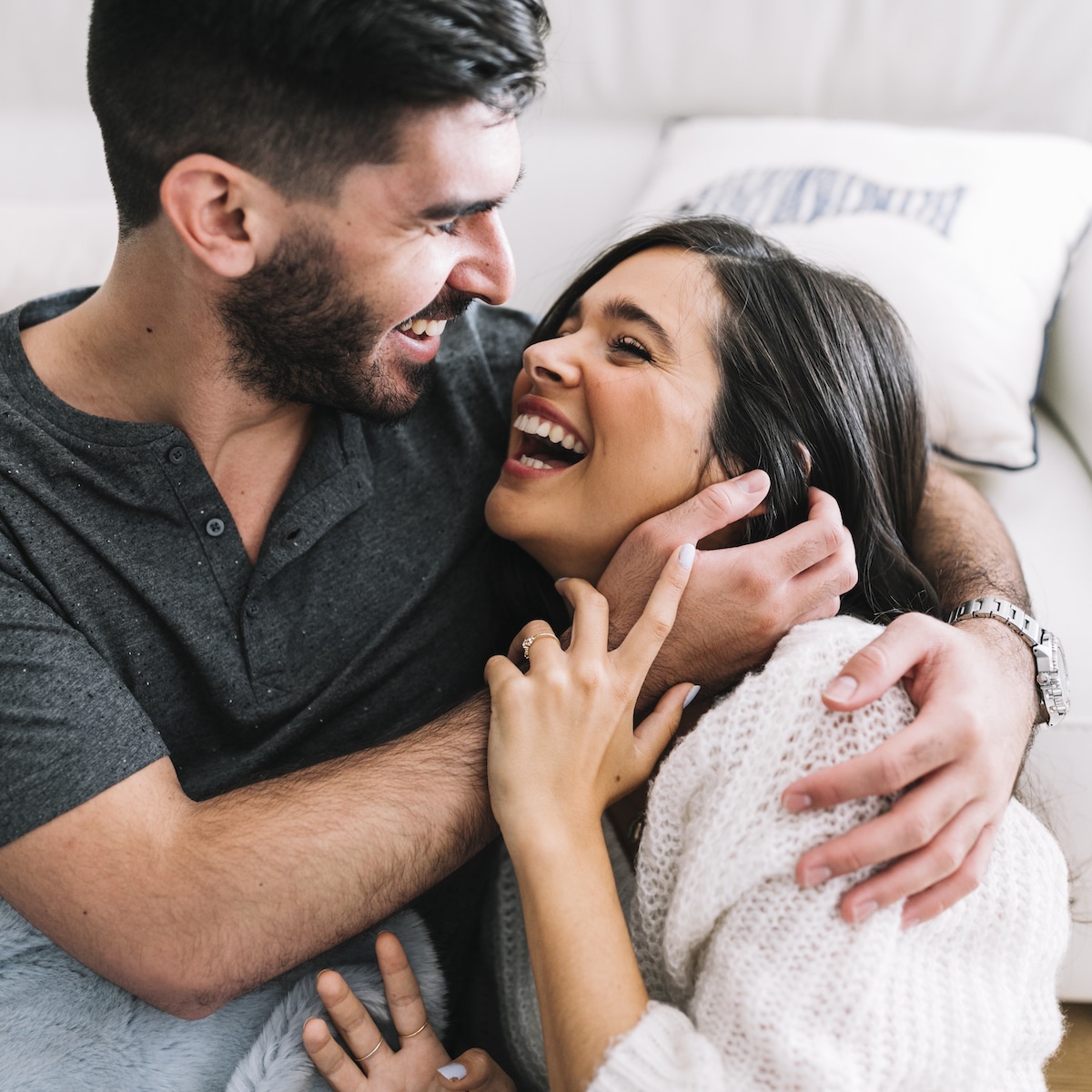 smiling young woman embracing laughing: this is the goal of a new relationship